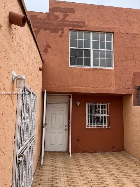 4250 West 11th Lane, Unit 43 Hialeah, FL 33012 - Photo 2 of 31 a front view of a house