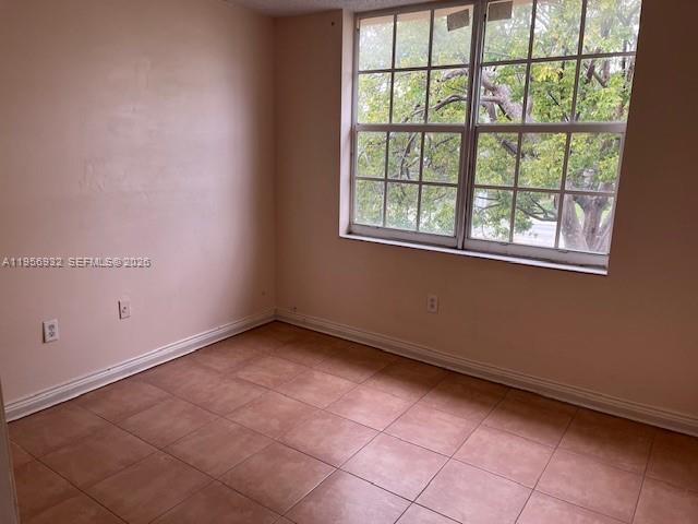 4250 West 11th Lane, Unit 43 Hialeah, FL 33012 - Photo 23 of 31 an empty room with a window