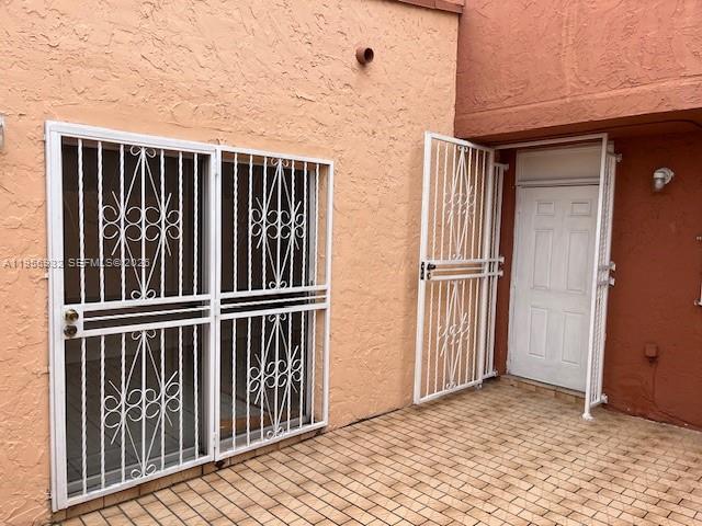 4250 West 11th Lane, Unit 43 Hialeah, FL 33012 - Photo 3 of 31 a view of wooden balcony