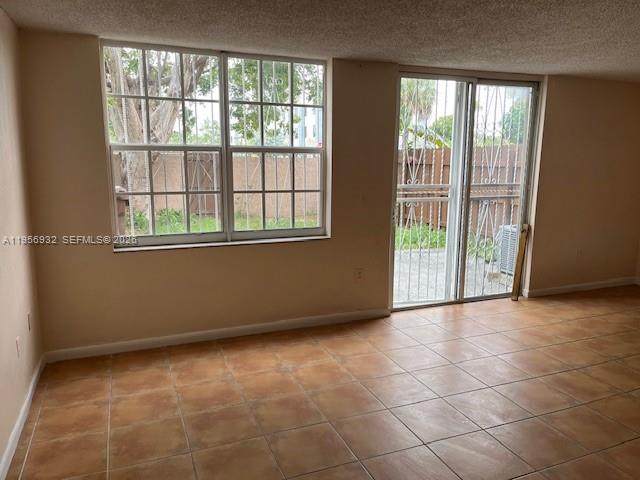 4250 West 11th Lane, Unit 43 Hialeah, FL 33012 - Photo 7 of 31 a view of an empty room with a window