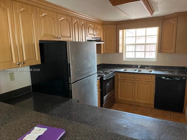 4250 West 11th Lane, Unit 43 Hialeah, FL 33012 - Photo 10 of 31 a kitchen with granite countertop a refrigerator stove and sink