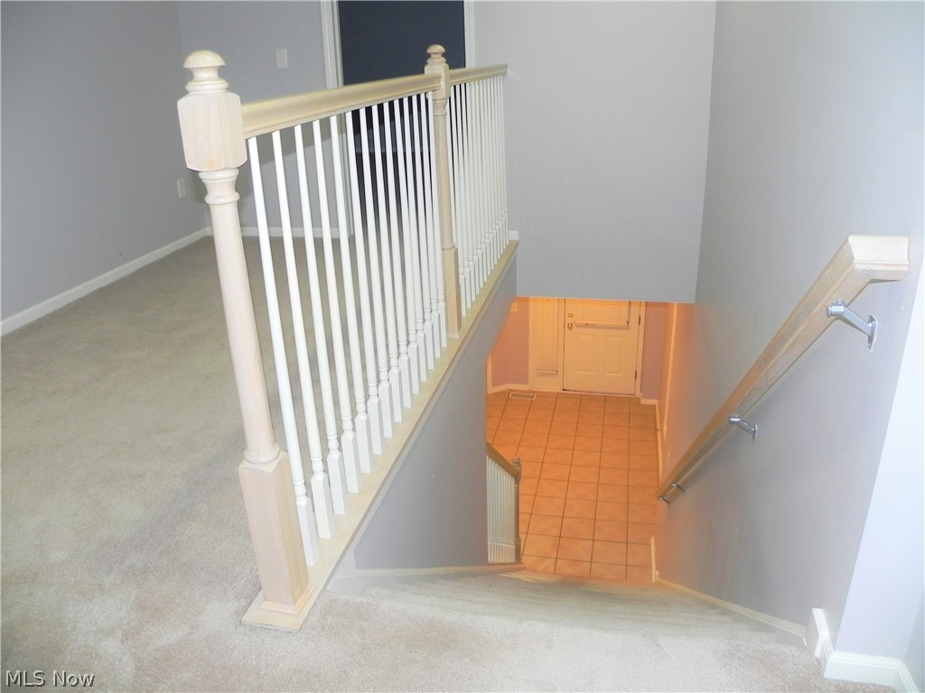 30239 Center Ridge Road, Unit 16 Westlake, OH 44145 - Photo 19 of 23 Stairs leading to finished baseent