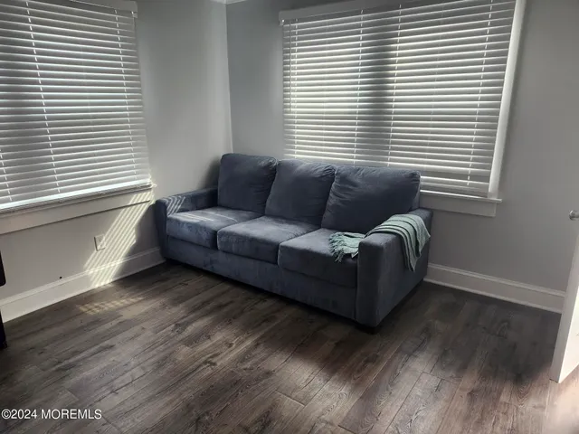a living room with furniture and window