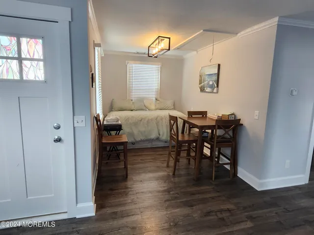 a view of a dining room with furniture and window