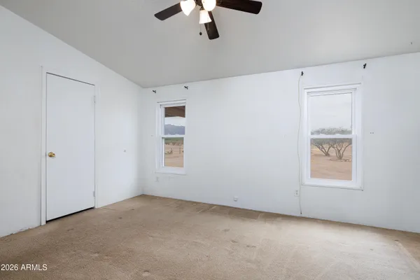 a bathroom with double sink and a mirror