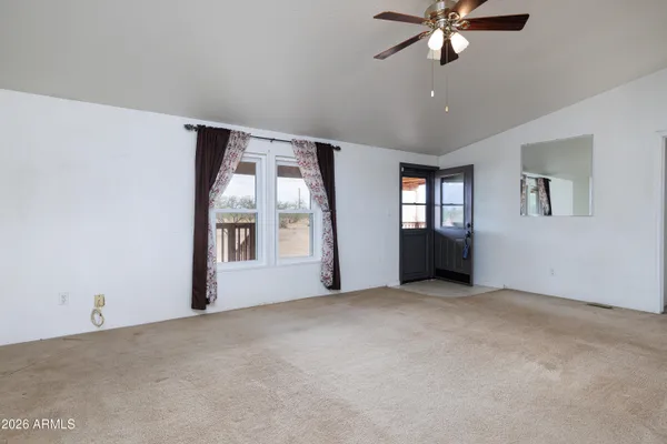 a view of a dining room with furniture window and outside view