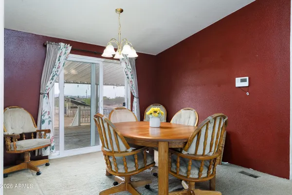 a kitchen with a sink a stove cabinets and a window