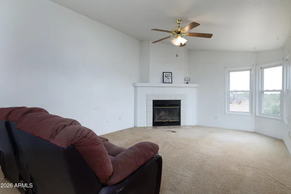 a kitchen with a refrigerator sink and cabinets