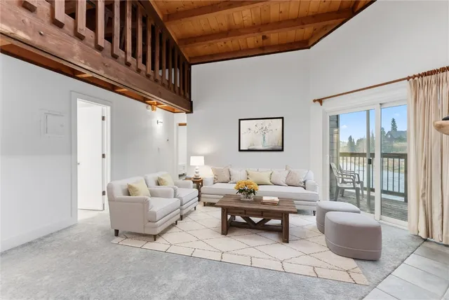 a kitchen with a table chairs sink and cabinets