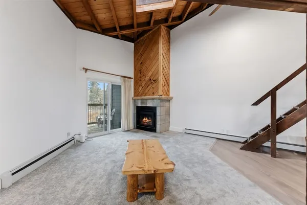 a view of backyard with a fireplace and window