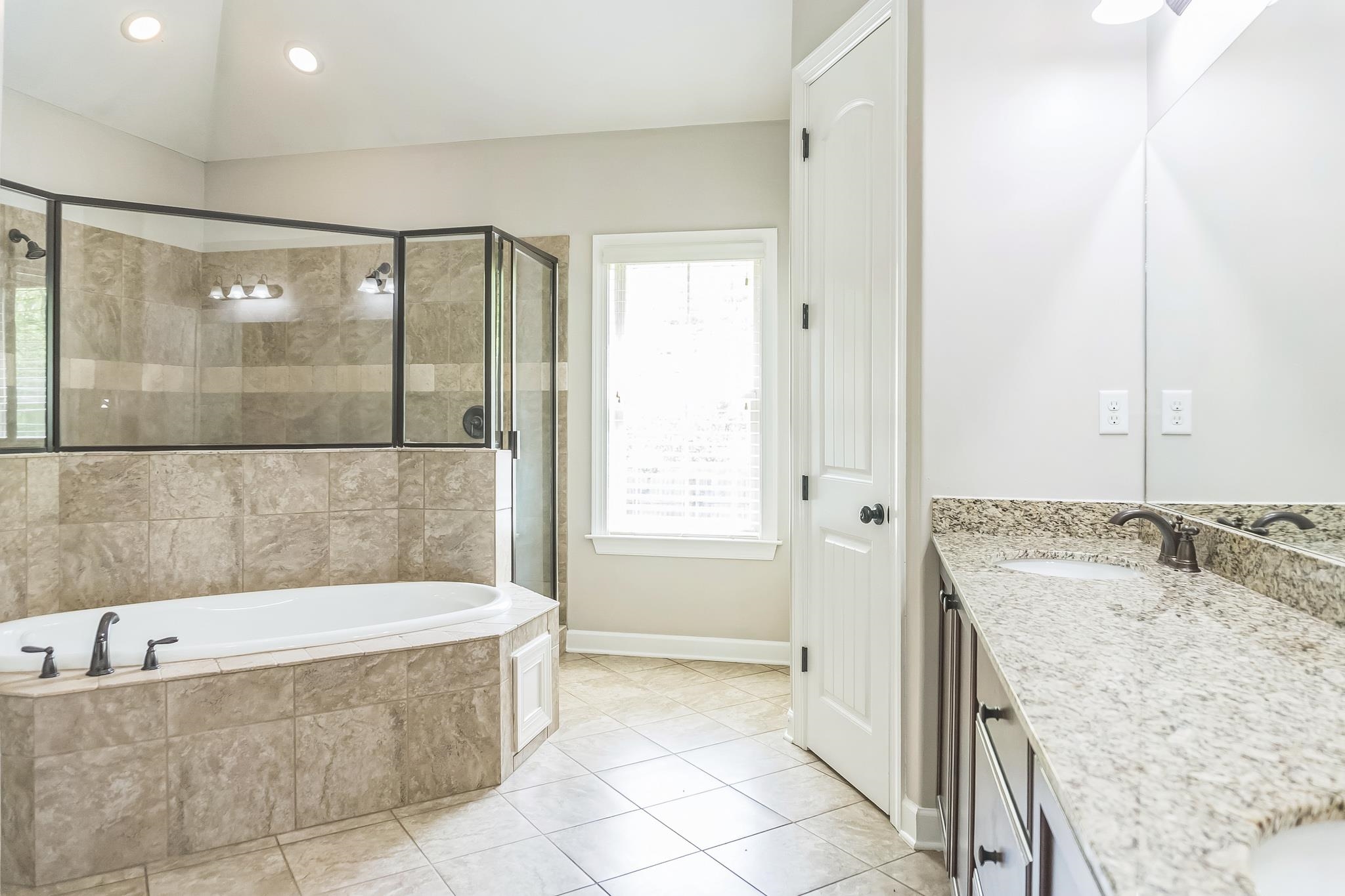 4948 Grace View Lane Bartlett, TN 38135 - Photo 12 of 21 a bathroom with a granite countertop tub shower and sink