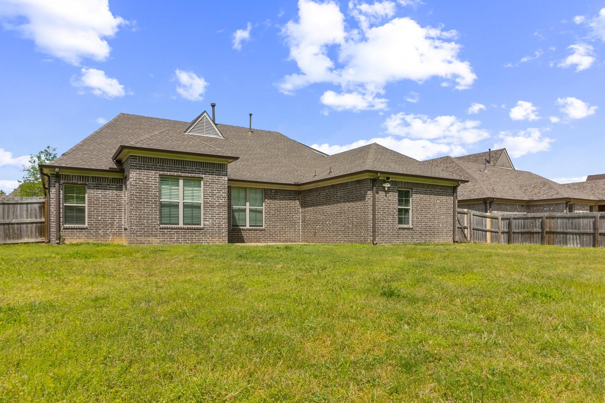 4948 Grace View Lane Bartlett, TN 38135 - Photo 21 of 21 a front view of a house with a garden