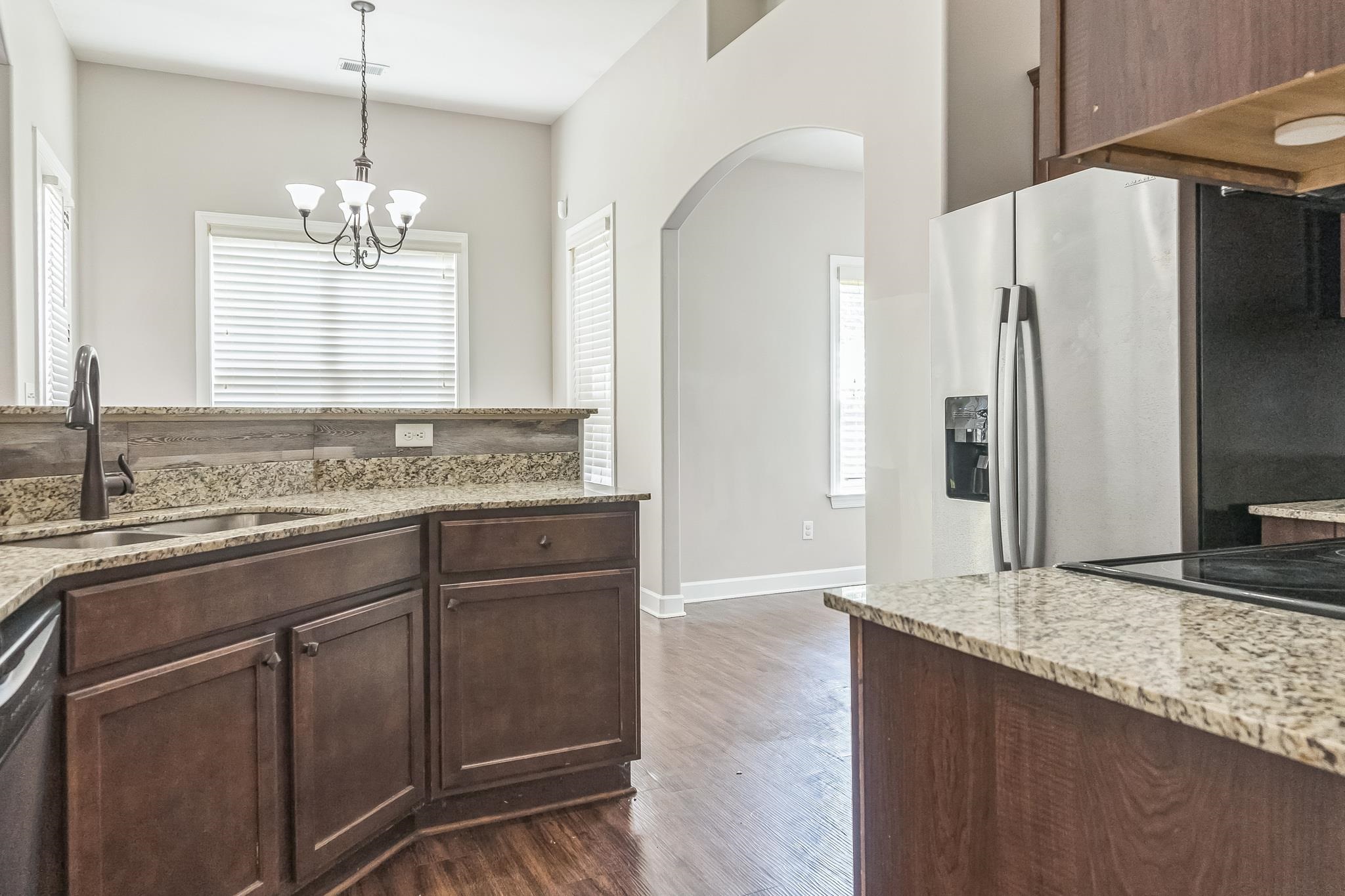 4948 Grace View Lane Bartlett, TN 38135 - Photo 7 of 21 a bathroom with a granite countertop sink and a mirror