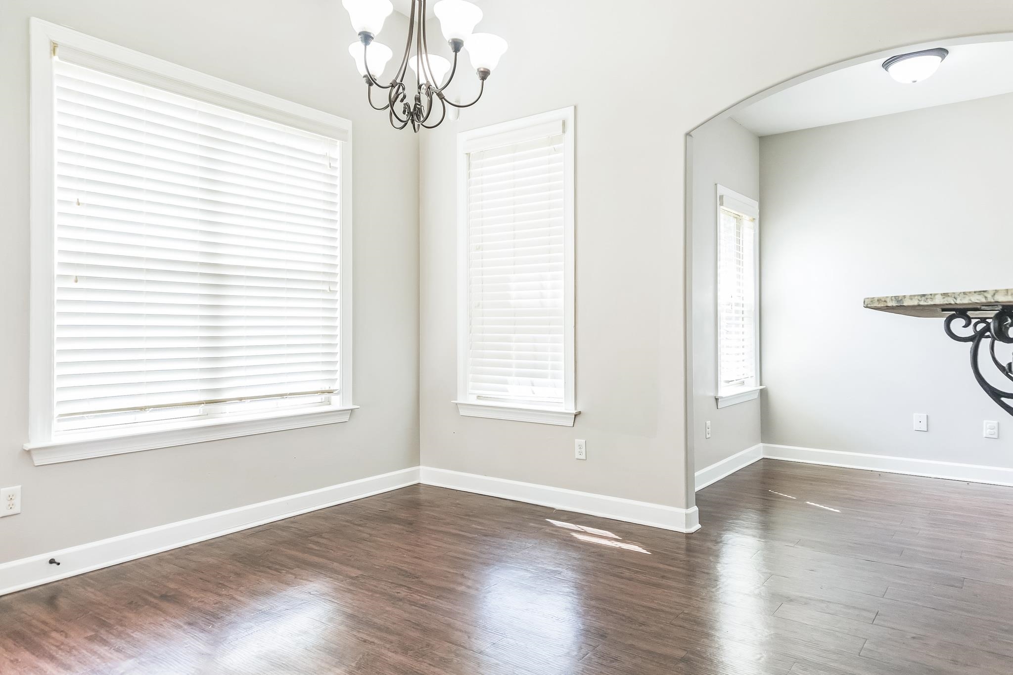 4948 Grace View Lane Bartlett, TN 38135 - Photo 9 of 21 a view of an empty room with wooden floor and a window