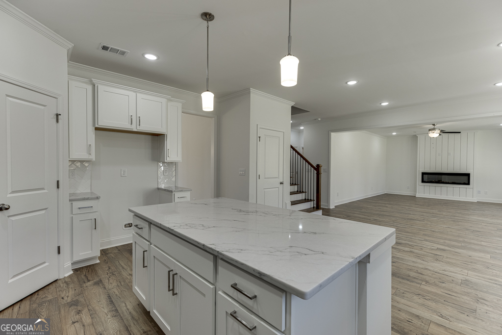 929 Lakeview Drive Commerce, GA 30529 - Photo 11 of 44 a kitchen with kitchen island a sink stainless steel appliances and wooden floor
