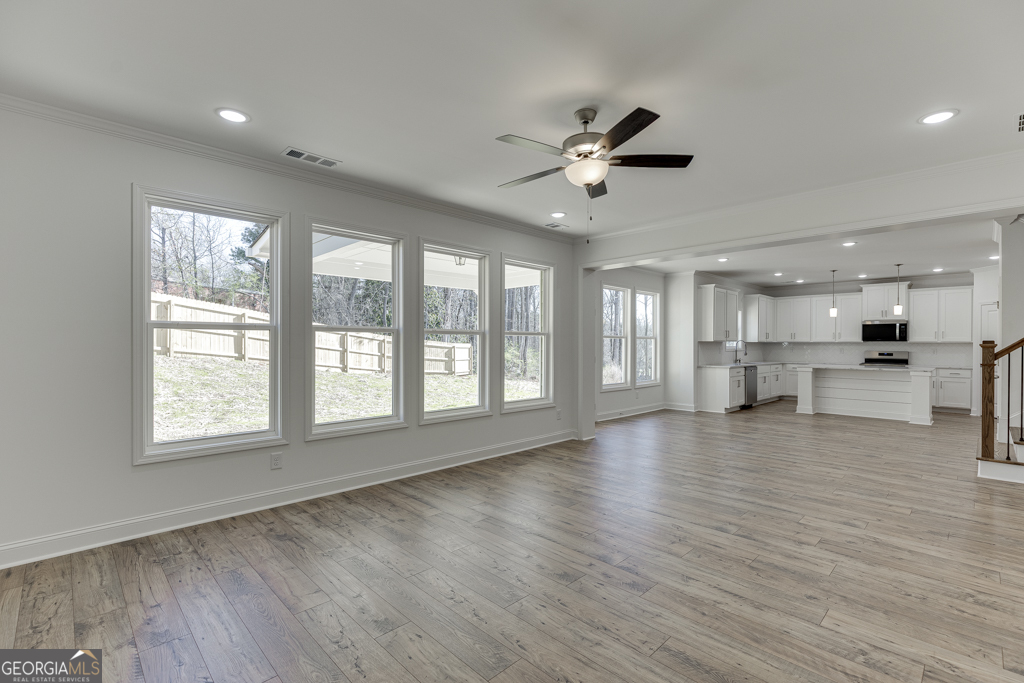 929 Lakeview Drive Commerce, GA 30529 - Photo 19 of 44 a view of an empty room with a window and wooden floor