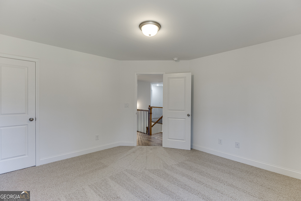 929 Lakeview Drive Commerce, GA 30529 - Photo 26 of 44 a view of an empty room and wooden floor