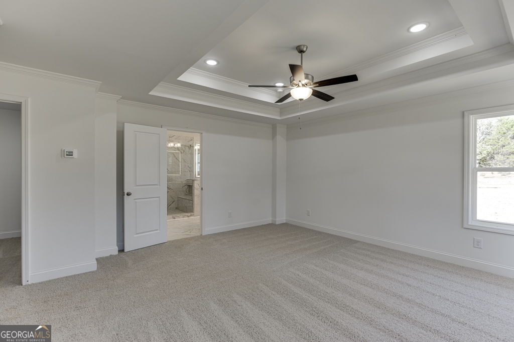 929 Lakeview Drive Commerce, GA 30529 - Photo 33 of 44 an empty room with chandelier fan and windows