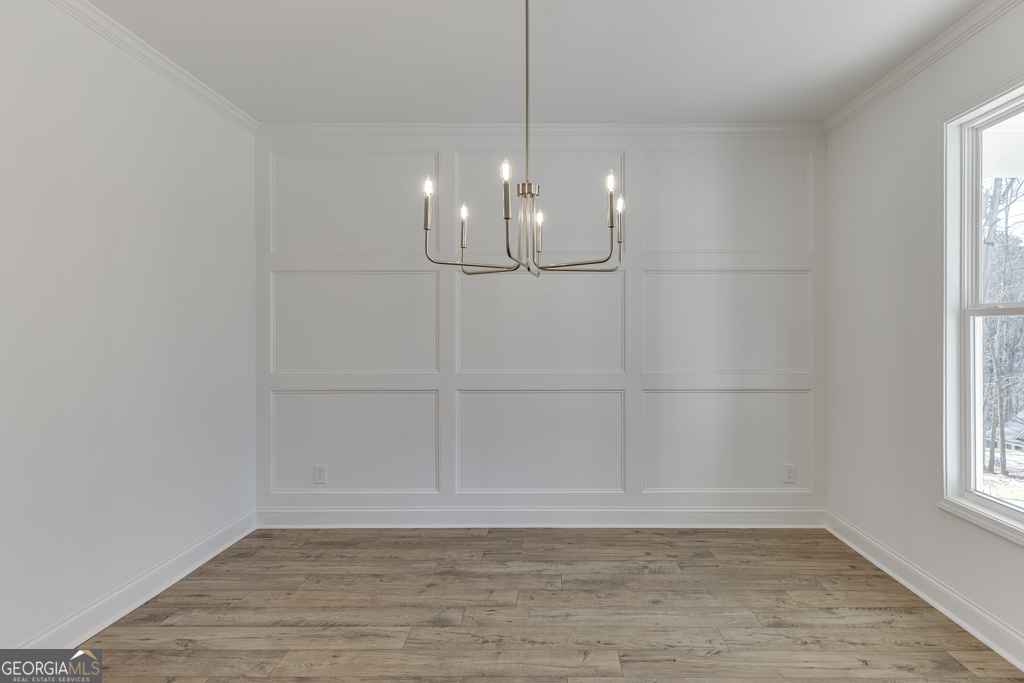 929 Lakeview Drive Commerce, GA 30529 - Photo 5 of 44 a view of a room with rack on the wall and a window