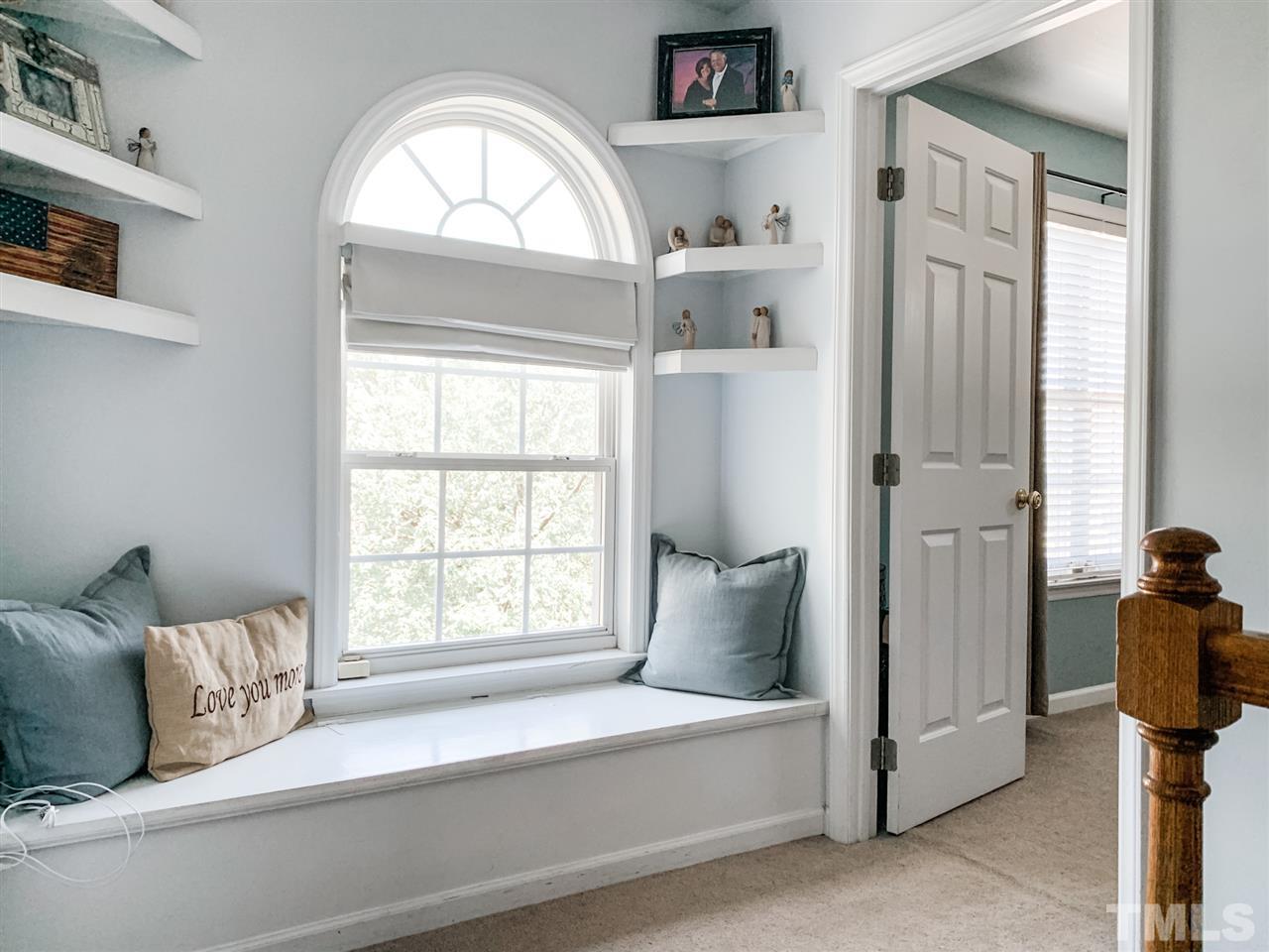 2128 Haig Point Way Raleigh, NC 27604 - Photo 15 of 30 Top of stairs custom window seat with storage and shelves. GORGEOUS!!