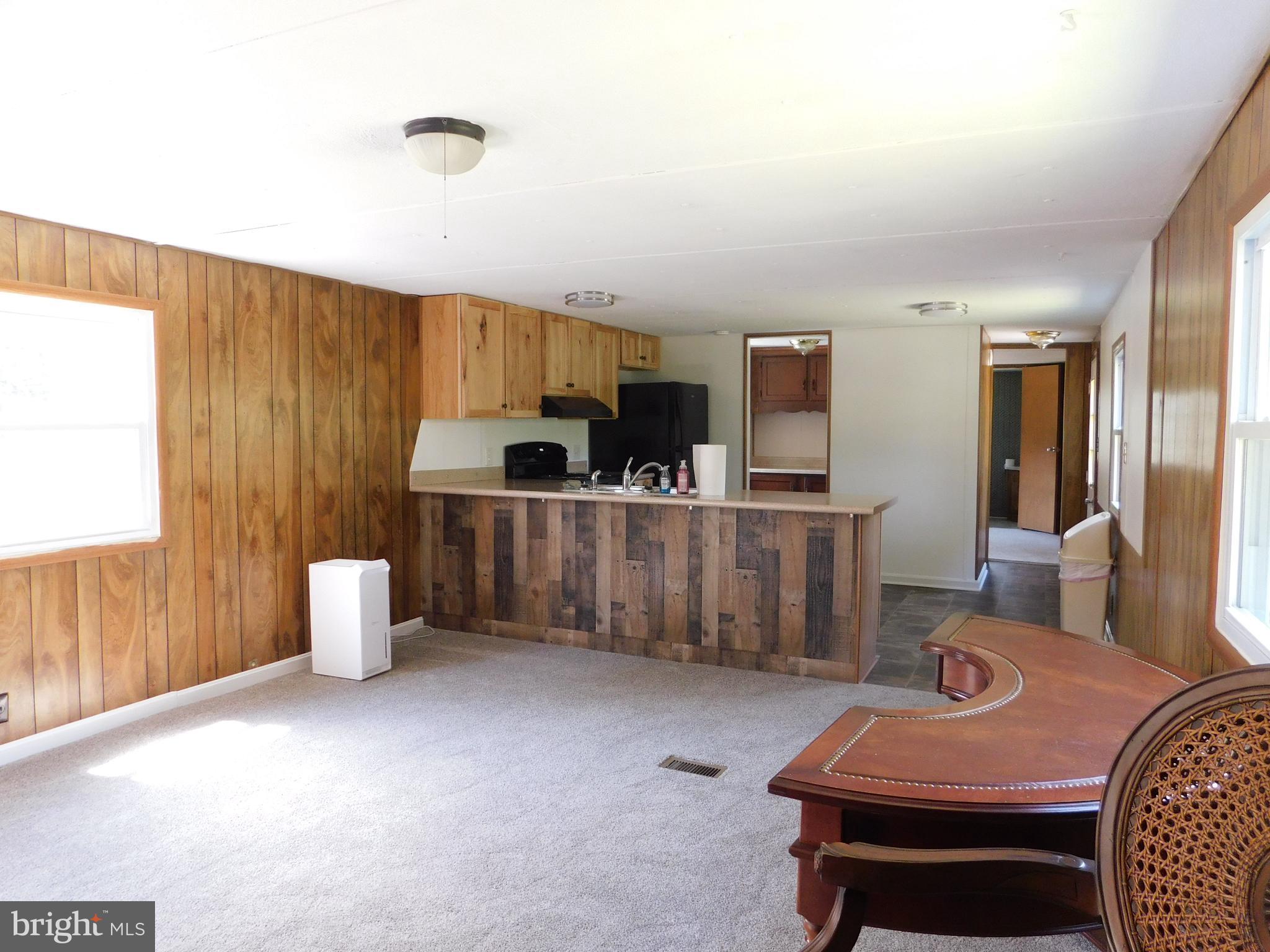 192 AA Rogers Road Augusta, WV 26704 - Photo 10 of 34 a living room with furniture and kitchen view