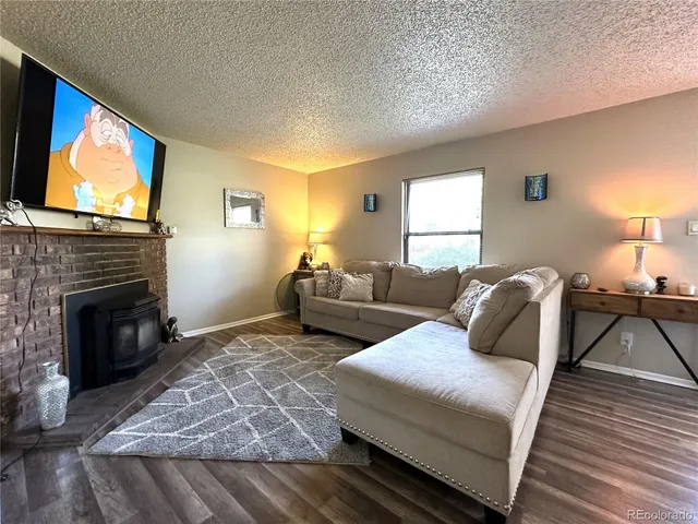 a bedroom with two beds and a flat screen tv