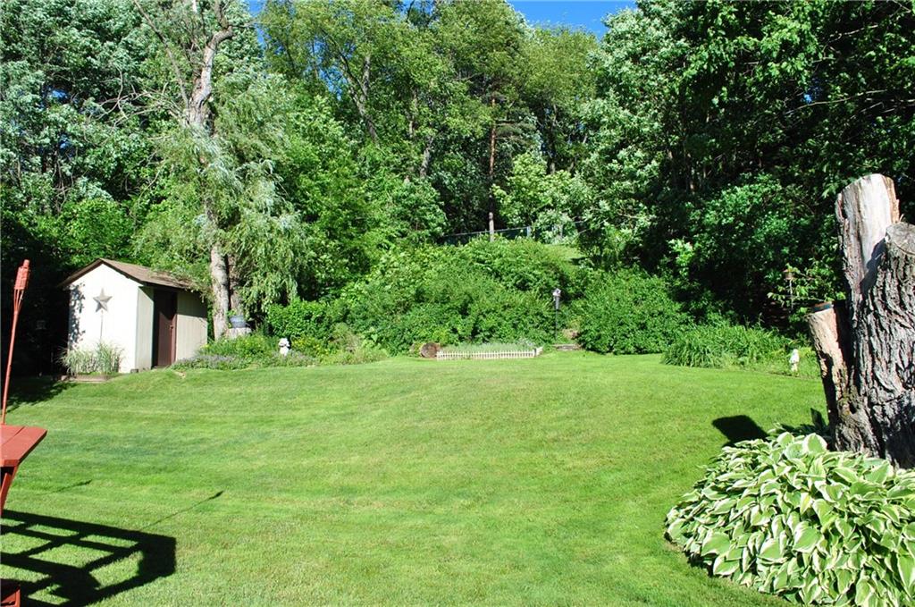 200 Rosscommon Road Wexford, PA 15090 - Photo 14 of 24 Spacious backyard with mature landscaping, flat area and a private hill top to watch the sunset. Shed is included in this completely fenced in backyard!