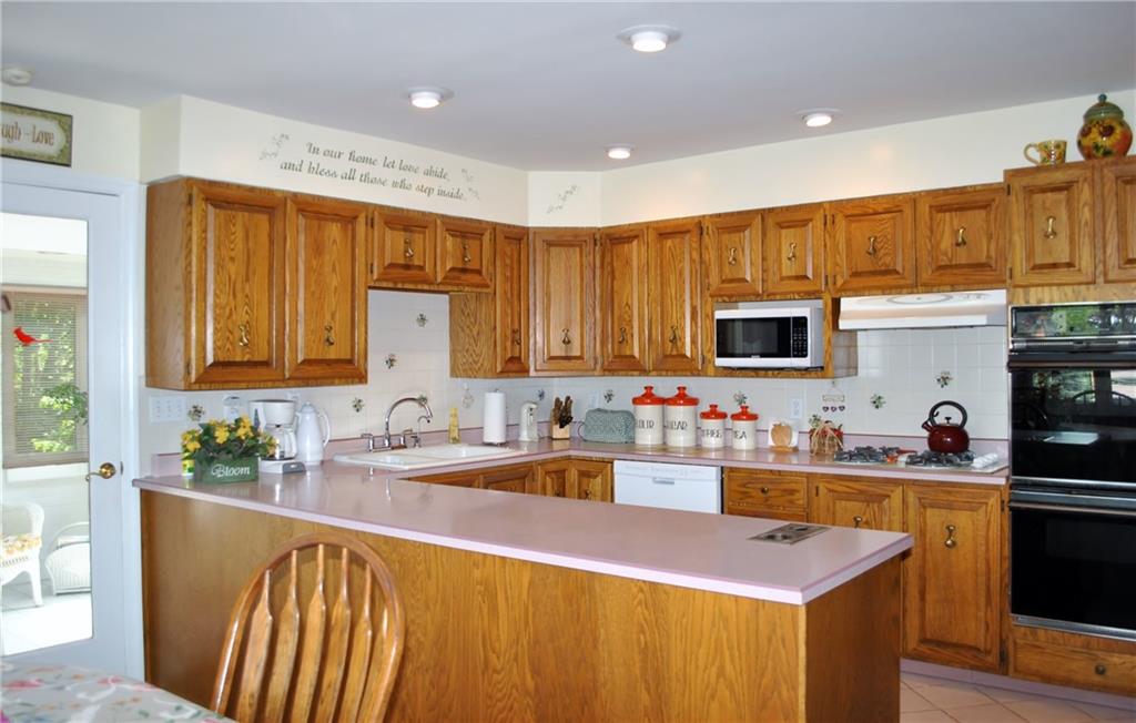 200 Rosscommon Road Wexford, PA 15090 - Photo 4 of 24 The Kitchen has so much to offer with tons of counter space, plenty of cabinets and pantry! Eat-in if you want or enjoy the sun room just off the Kitchen.