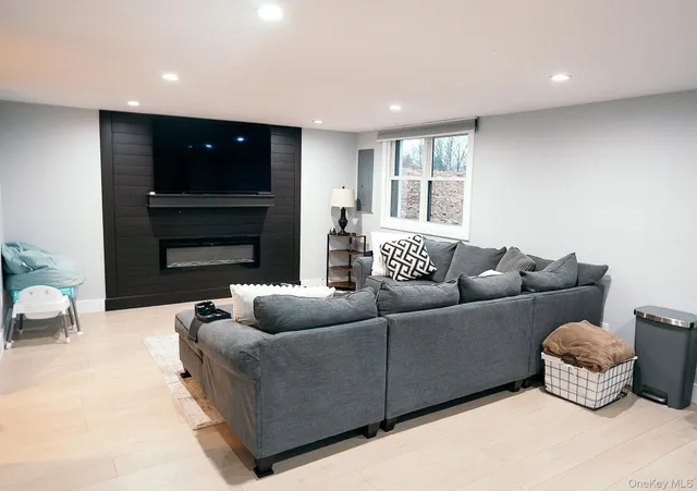 a living room with furniture window and a fireplace