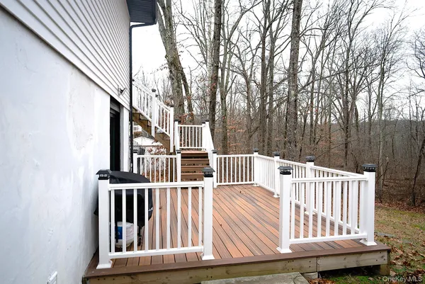 a view of outdoor space with deck and furniture