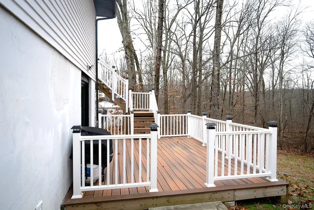 a view of outdoor space with deck and furniture