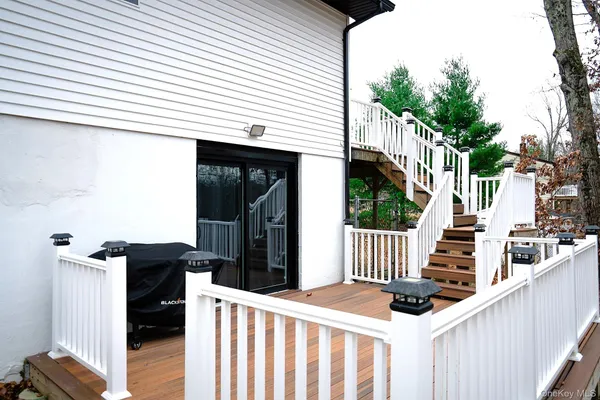 a view of a brick wall with seating space