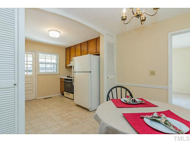 1317 Clermont Road Durham, NC 27713 - Photo 7 of 25 a bedroom with a bed and a dresser