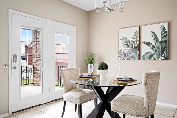 a dining room with furniture and chandelier