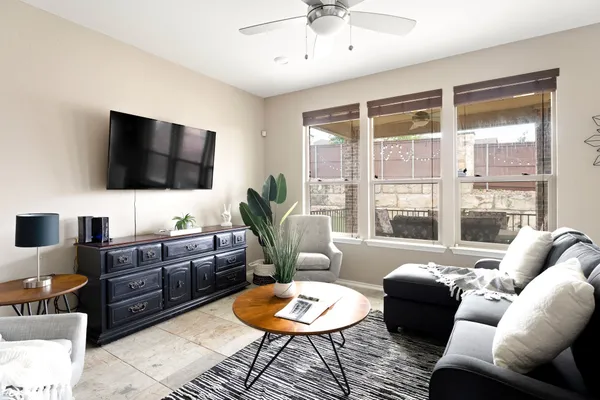 a living room with furniture or outdoor view and a large window