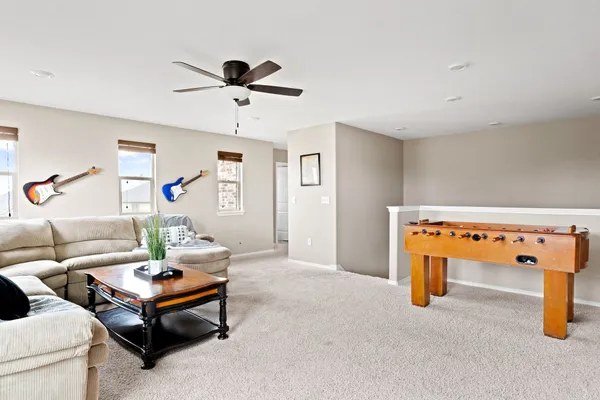 a living room with furniture and a table