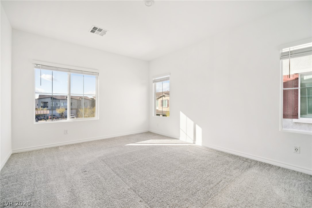 7348 North Decatur Boulevard, Unit 1 North Las Vegas, NV 89084 - Photo 13 of 17 A quiet retreat with plush carpeting and abundant natural light filtering through the windows.