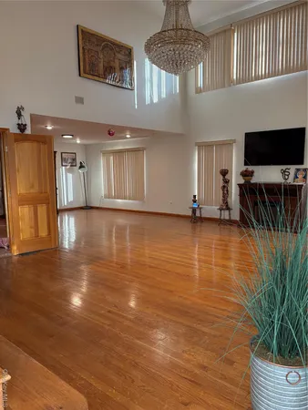 a view of room with window and wooden floor