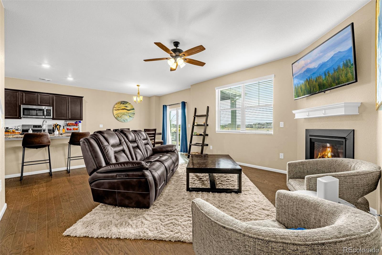 91 South Quantock Street Aurora, CO 80018 - Photo 18 of 45 a living room with furniture kitchen view and a window