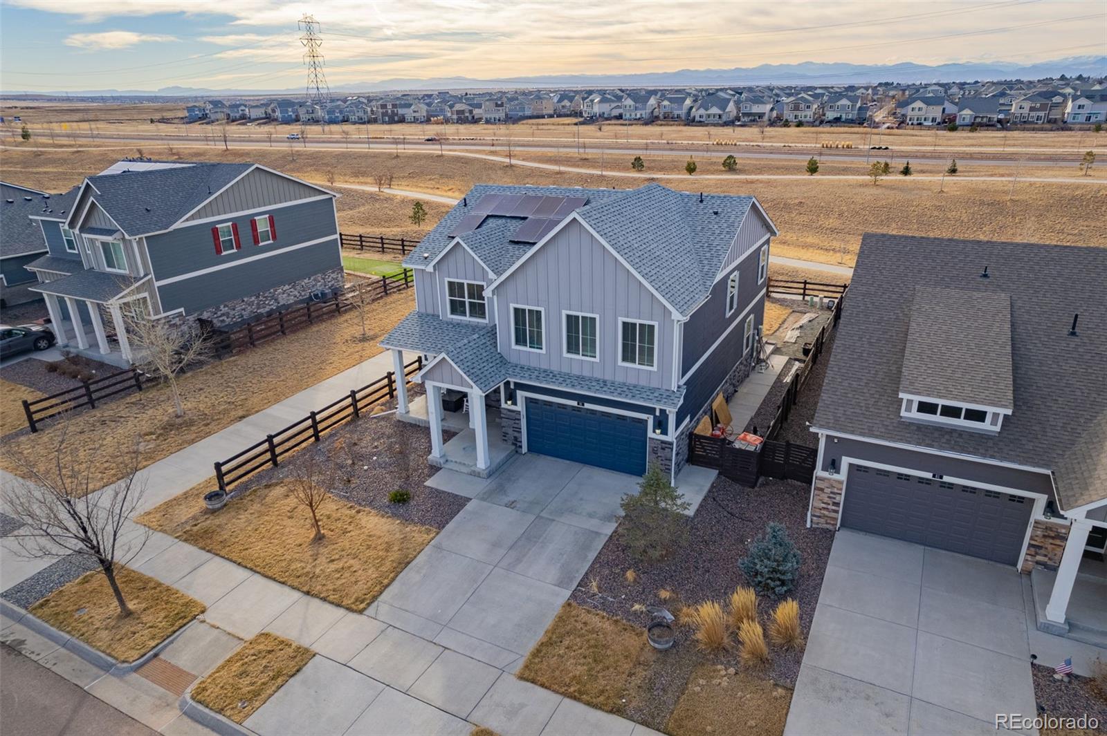 91 South Quantock Street Aurora, CO 80018 - Photo 4 of 45 an aerial view of a house with a swimming pool and outdoor space