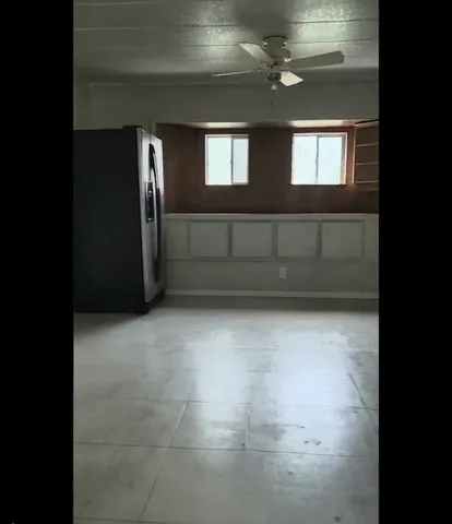 a kitchen with a refrigerator stove and cabinets