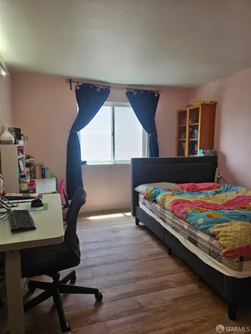 a bedroom with a bed and a table in it