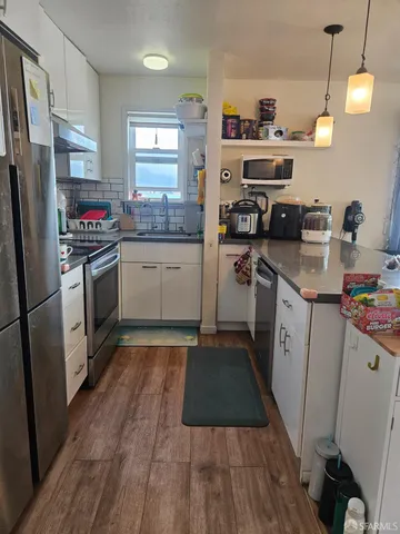 a living room with furniture fireplace and window