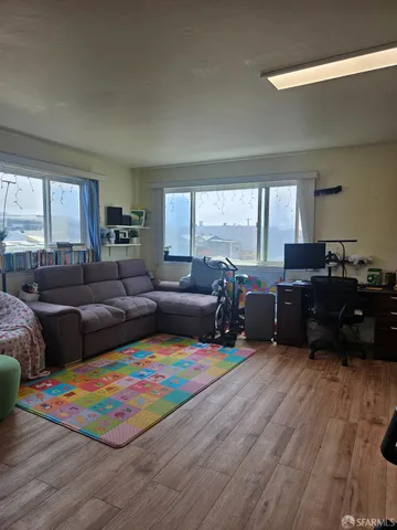 a living room with furniture and a table