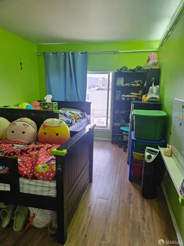 a room with furniture and a wooden floor