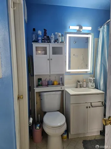 a bathroom with a bathtub and a toilet