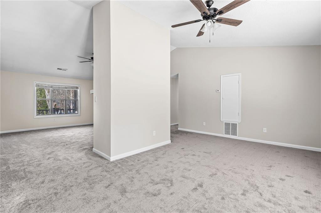 5345 Memorial Lane Southwest Powder Springs, GA 30127 - Photo 11 of 35 an empty room with windows and cabinet