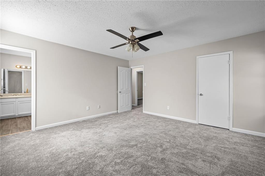 5345 Memorial Lane Southwest Powder Springs, GA 30127 - Photo 27 of 35 a view of a livingroom with a ceiling fan
