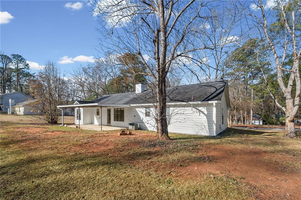 5345 Memorial Lane Southwest Powder Springs, GA 30127 - Photo 32 of 35 a view of a house with a yard