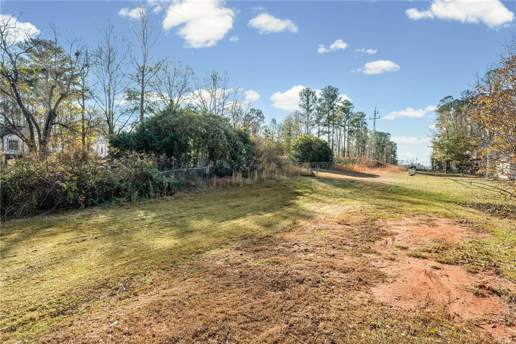 5345 Memorial Lane Southwest Powder Springs, GA 30127 - Photo 34 of 35 a view of a swimming pool with an outdoor space and seating area